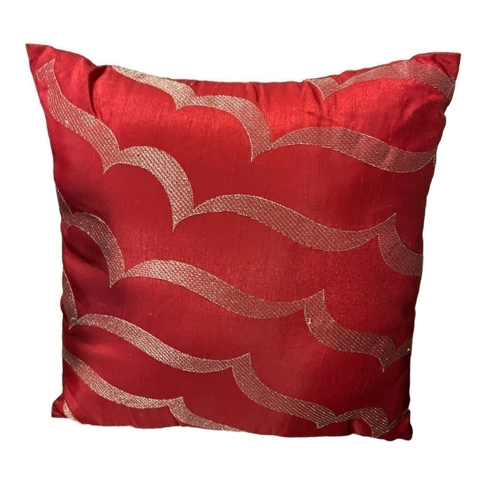 ACCENT pillow red poly/satin with silver metallic thread in waves on front.